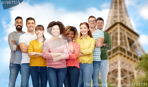 Image of international group of people over eiffel tower