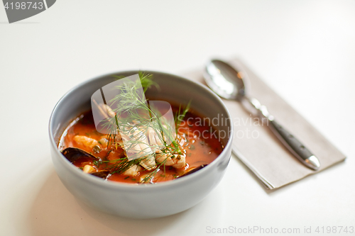 Image of seafood soup with fish and blue mussels in bowl