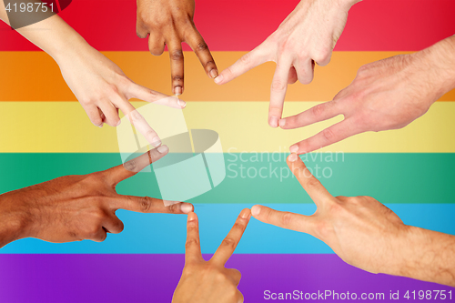 Image of group of international people showing peace sign