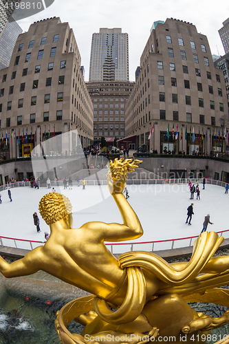 Image of Golden Prometheus statue and Rockefeller Center ice skate rink, Manhattan, New York City, USA.