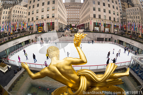 Image of Golden Prometheus statue and Rockefeller Center ice skate rink, Manhattan, New York City, USA.