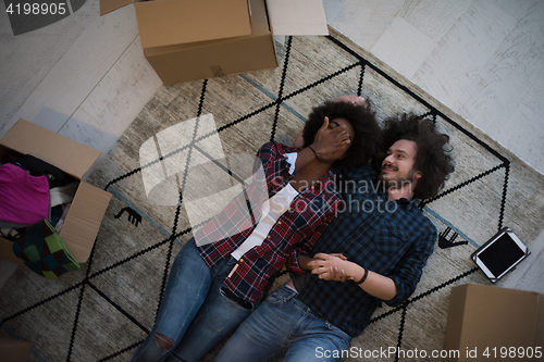 Image of Top view of attractive young multiethnic couple