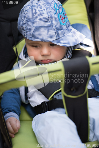 Image of baby boy sitting in the pram