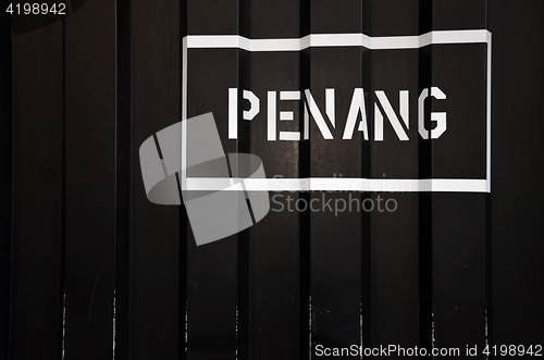Image of Penang sign on a black wall