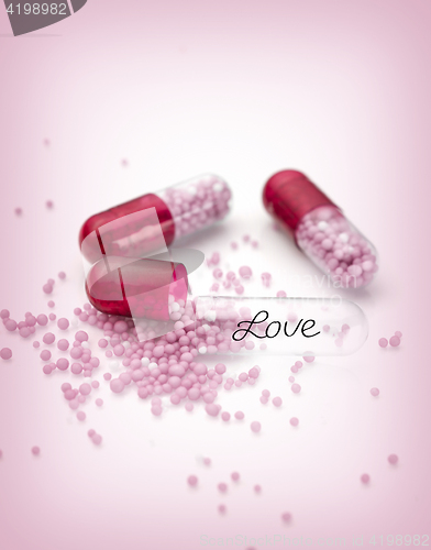 Image of Pink capsules and pills background