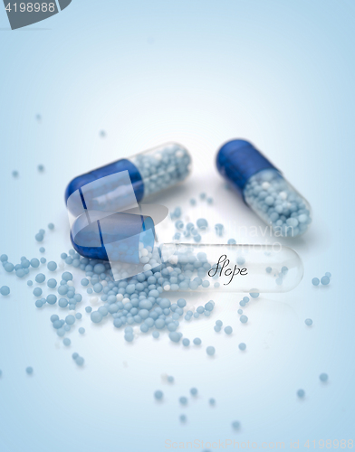 Image of Blue capsules and pills background