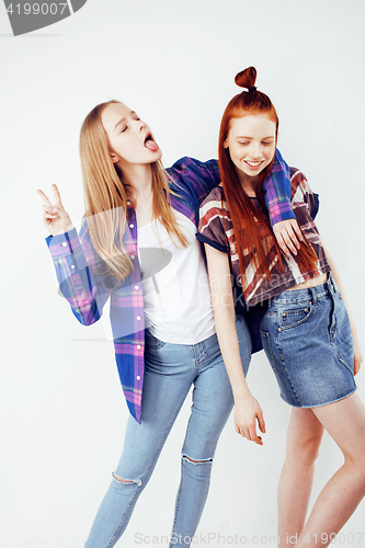 Image of lifestyle people concept: two pretty stylish modern hipster teen girl having fun together, happy smiling making selfie 