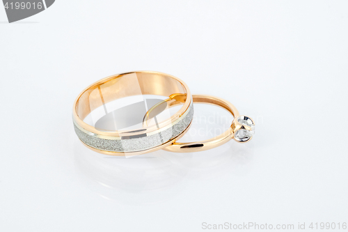 Image of Gold wedding rings on white