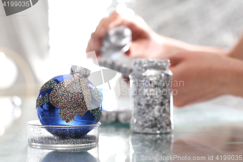 Image of Christmas decorations factory, the position of decorating glass ornaments