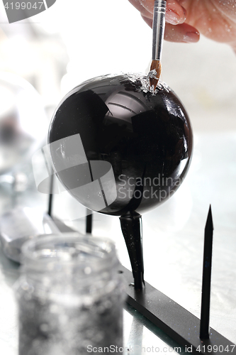 Image of Christmas decorations. A self painted Christmas balls Black bauble Christmas tree 