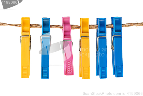 Image of Multicolored plastic clothespins on a rope