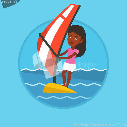 Image of Young woman windsurfing in the sea.