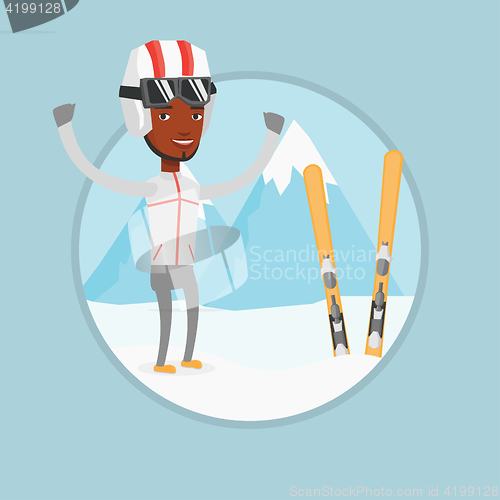 Image of Cheerful skier standing with raised hands.