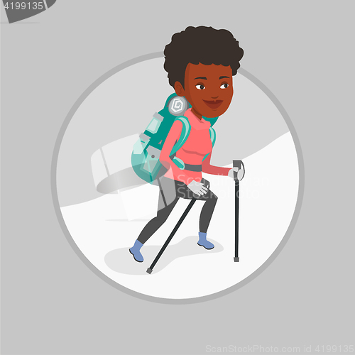 Image of Young mountaneer climbing a snowy ridge.