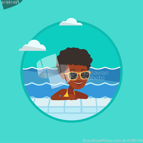 Image of Smiling young woman in swimming pool.