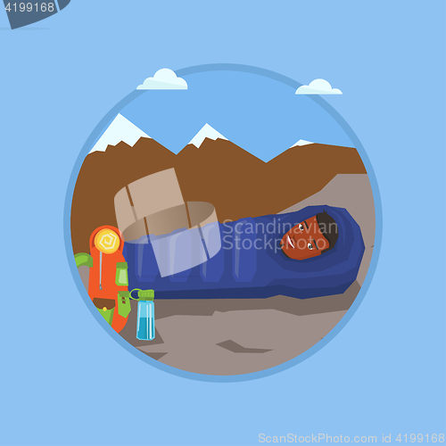 Image of Man sleeping in sleeping bag in the mountains.