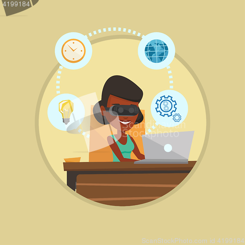 Image of Business woman in vr headset working on computer.