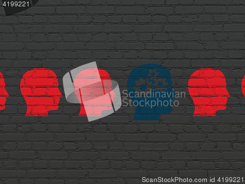 Image of Business concept: head with gears icon on wall background