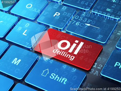 Image of Manufacuring concept: Oil Drilling on computer keyboard background