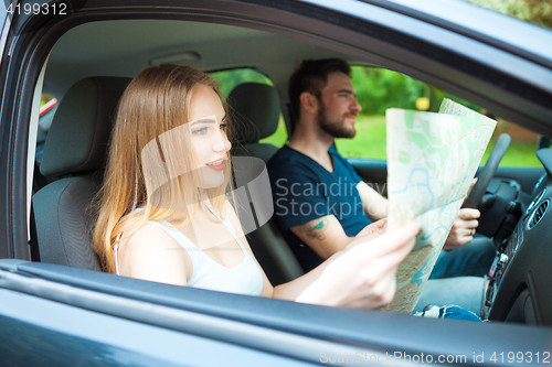 Image of Couple of young people traveling