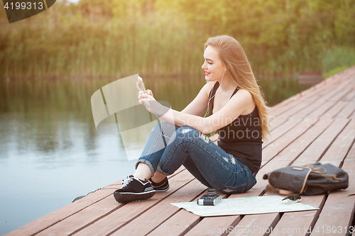 Image of Pretty young woman traveling