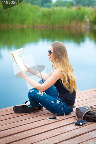 Image of Young traveler searching road