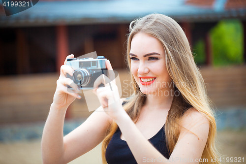 Image of Young traveling woman in country