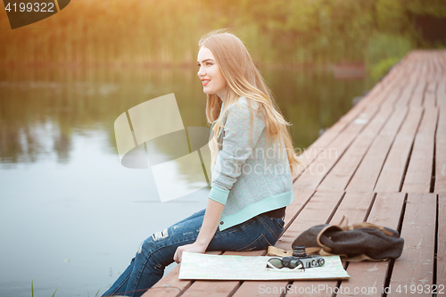 Image of Pretty young woman traveling