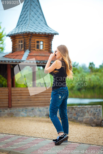 Image of Young traveling woman in country