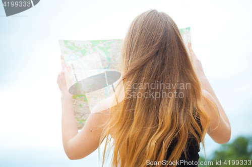 Image of Young traveler searching road