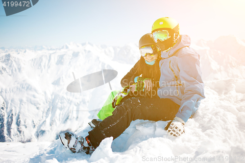 Image of Couple hugging among winter mountain