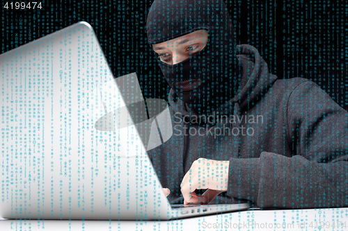 Image of Robber breaks into computer system