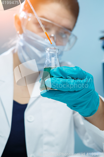 Image of Woman in mask at lab