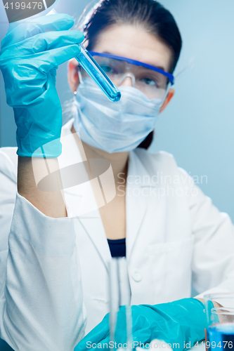 Image of Woman working with test tubes