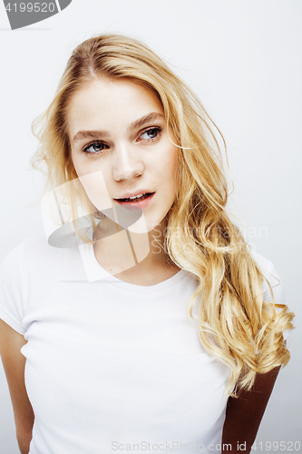 Image of young pretty blond teenage girl emotional posing, happy smiling isolated on white background, lifestyle people concept