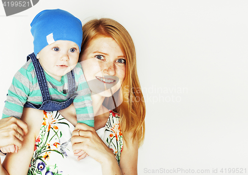 Image of young beauty mother with cute baby, red head happy modern family