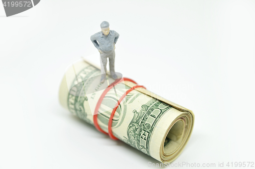 Image of Figure of businessman on one dollar