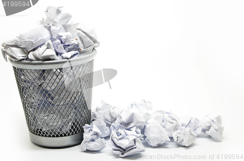 Image of Garbage bin with paper waste