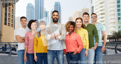 Image of international group of happy people in city