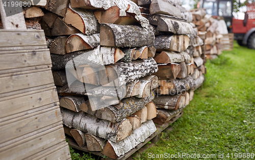 Image of stack of firewood on farm at country