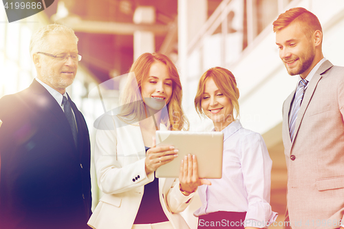 Image of business people with tablet pc computers at office