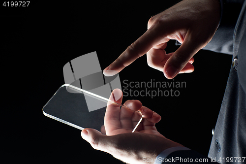 Image of close up of businessman with glass smartphone