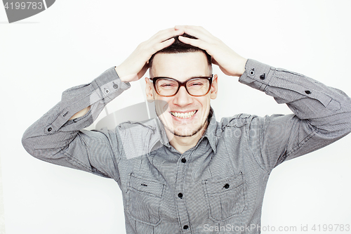 Image of young handsome well-groomed guy posing emotional on white background, lifestyle people concept