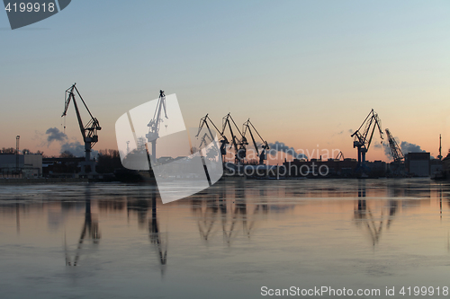 Image of  portal cranes on horizon