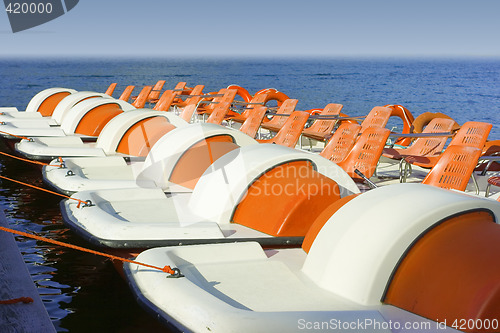 Image of Colorful catamarans on leash