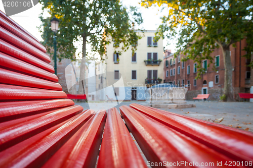 Image of Venice from a red bench