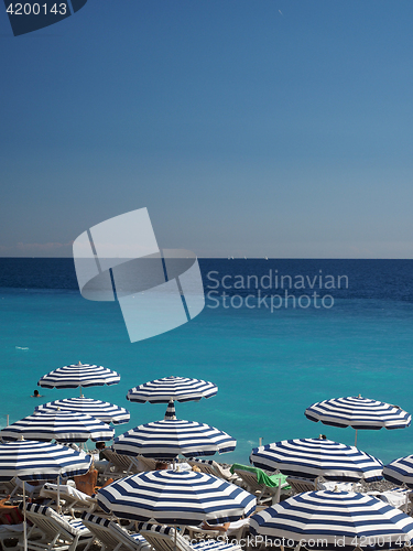 Image of umbrellas  beach in Nice, France The French Riviera 