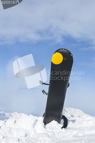 Image of Snowboard in Snow