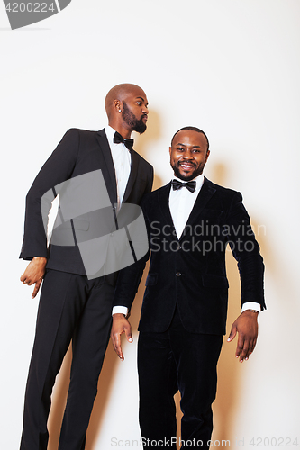 Image of two afro-american businessmen in black suits emotional posing, g