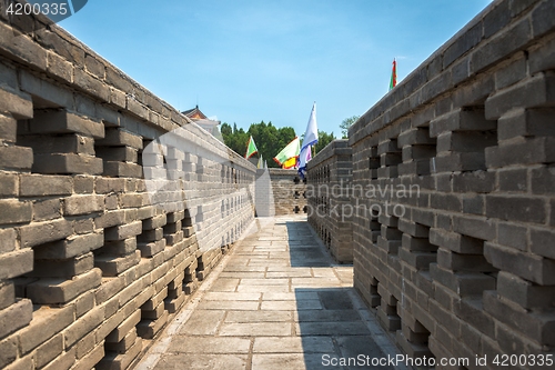 Image of Stone path outdoors with large walls